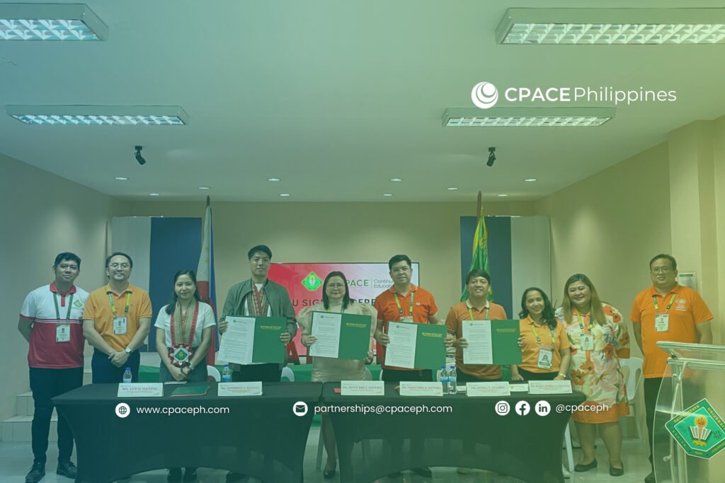 Group of representatives at CPACE–CVSU partnership signing, holding documents in a formal ceremony.